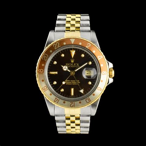 Rolex 16753 GMT Master Root Beer w/ Gilt dial , 18k gold and